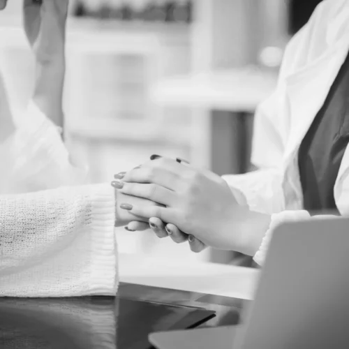 therapist holding client during anxiety treatment in singapore.